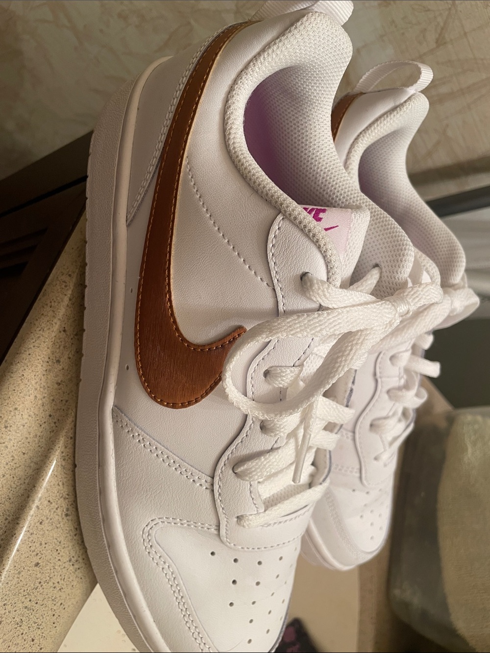 Nike Women's White Sneakers with Metallic Bronze Swoosh